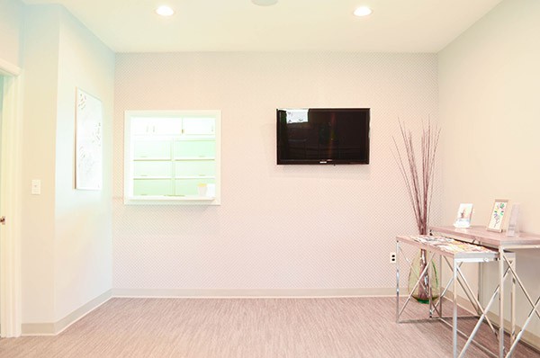 Interior photo of a bright, modern Reception window at Mint Braces in Somerset NJ