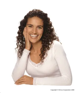 Photo of confident, smiling woman with dental braces